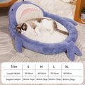 Blue shark pattern velvet pet bed cushion with thick padding on a wooden floor