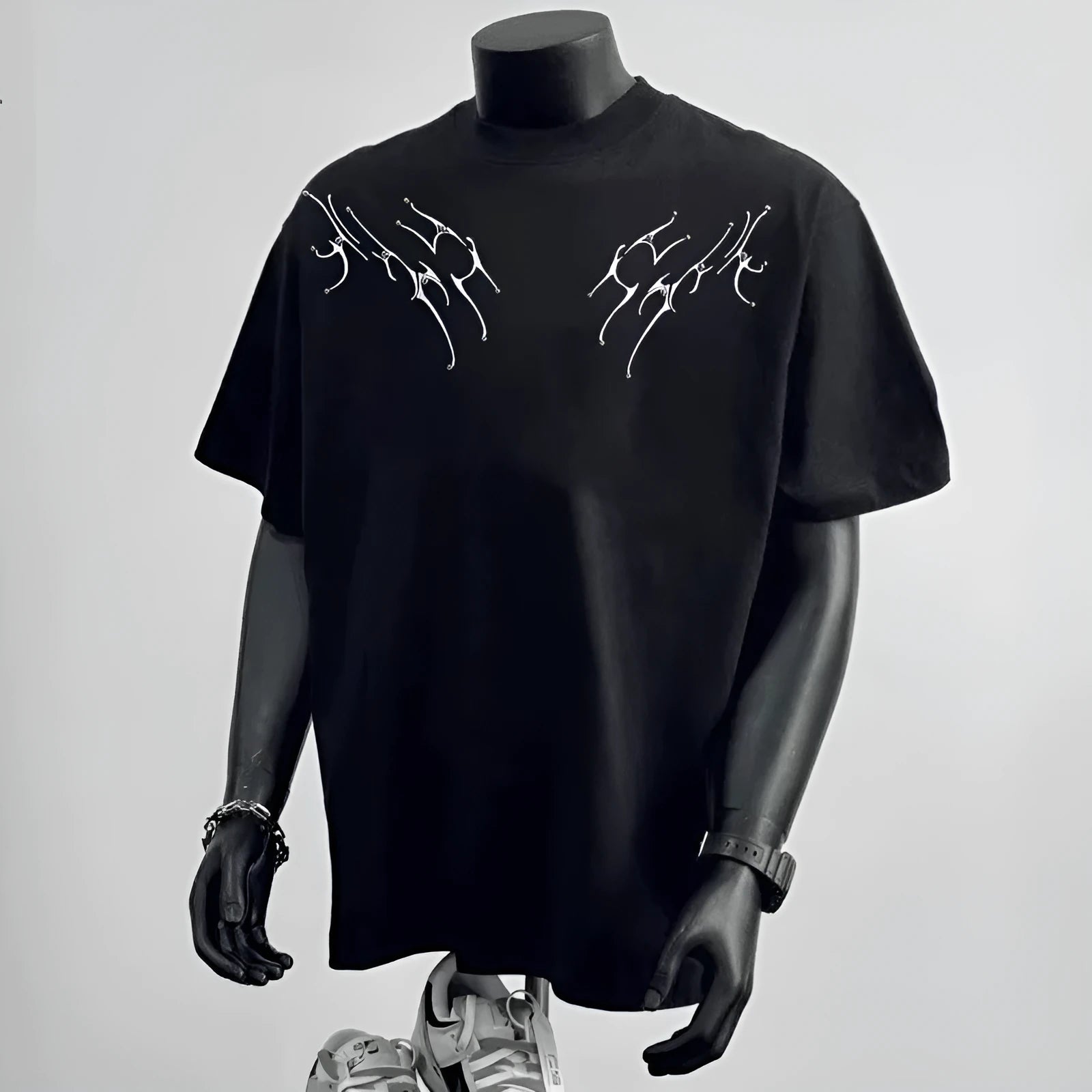 Men's black loose fit short sleeve cotton t-shirt with a print, laid flat.
