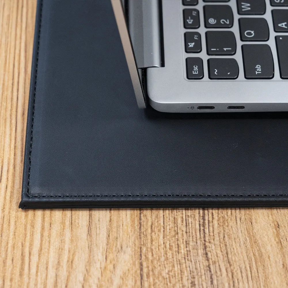 Anti-radiation tablet pad in multiple colours on a desk next to a tablet