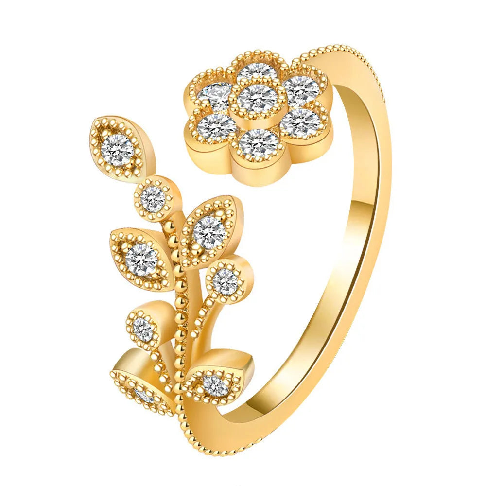 Women's open mouth copper ring with diamond-textured flower and leaves design in gold or white finish.