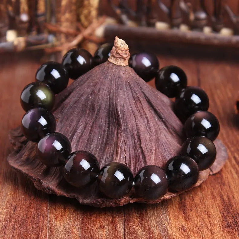 Polished natural crystal Pi Xiu bracelet with ethnic geometric design on a wrist