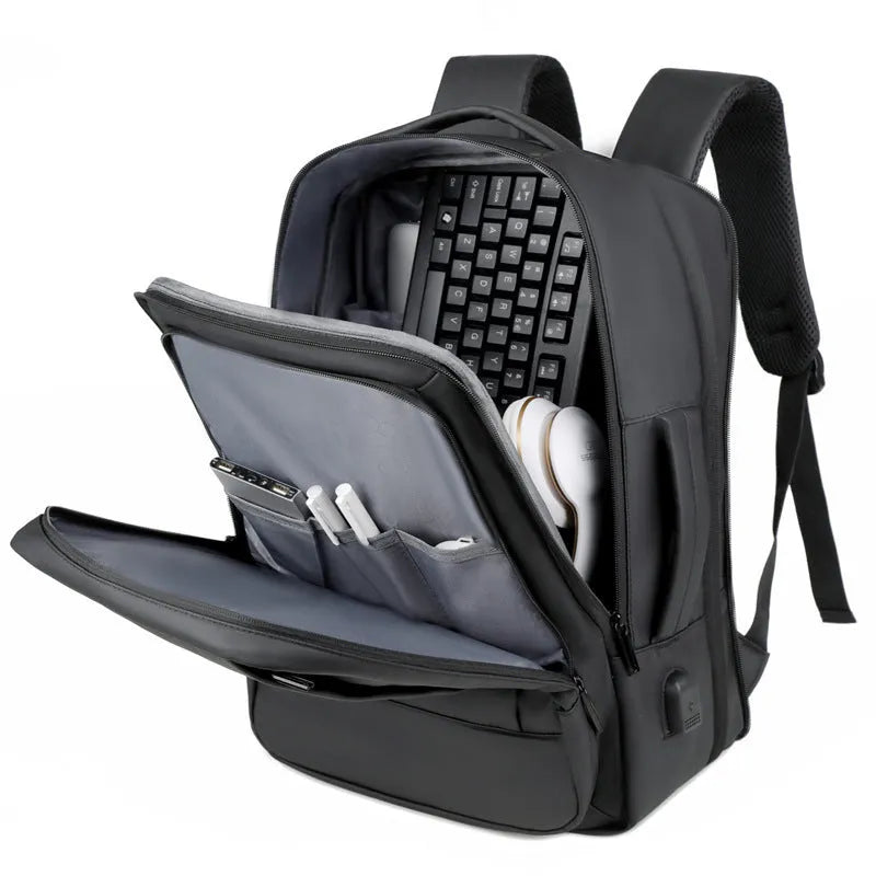 Black waterproof Oxford cloth business backpack with curved shoulder strap showing laptop compartment and 20-35L capacity.