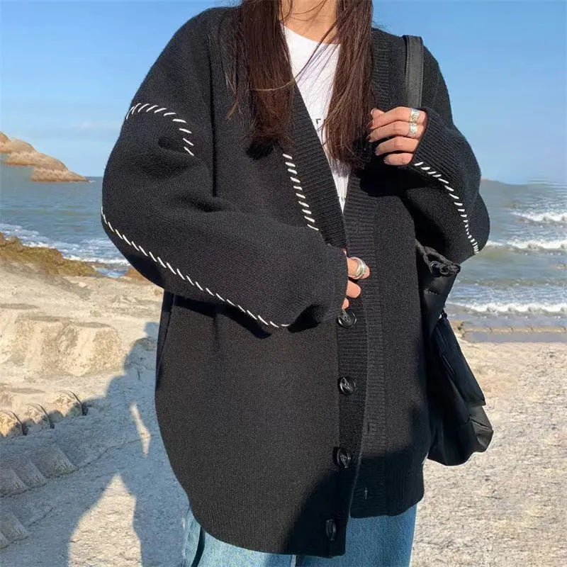 Women's loose fit knitted cardigan coat in solid black colour with long sleeves
