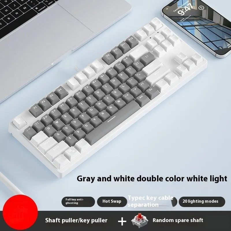 87-key wired mechanical gaming keyboard with colourful keycaps on a metal frame, shown with key puller and cable.