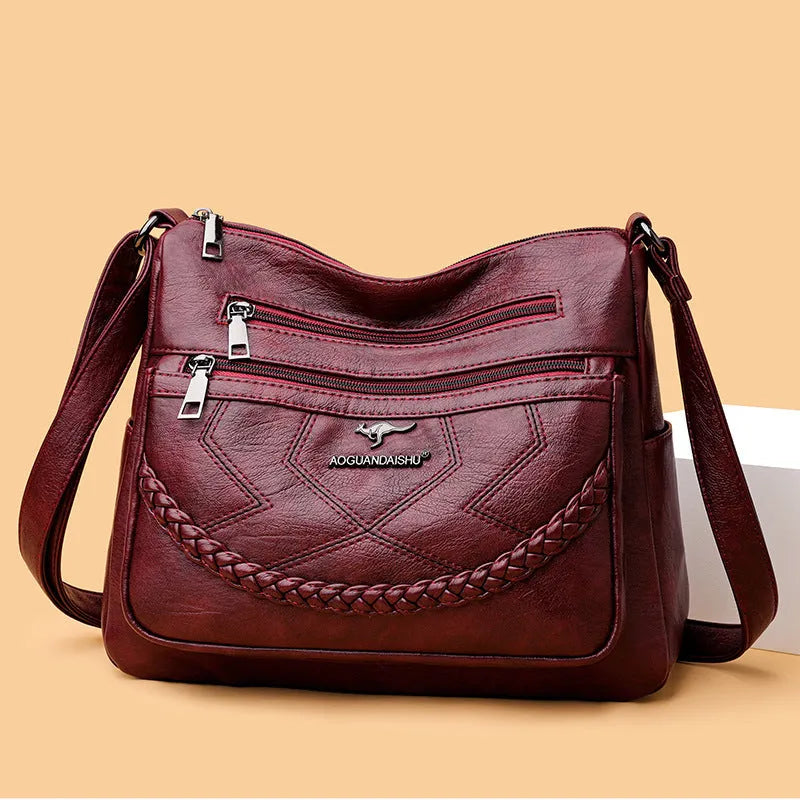 Soft PU leather shoulder bag in horizontal square shape with crossbody strap and multiple compartments