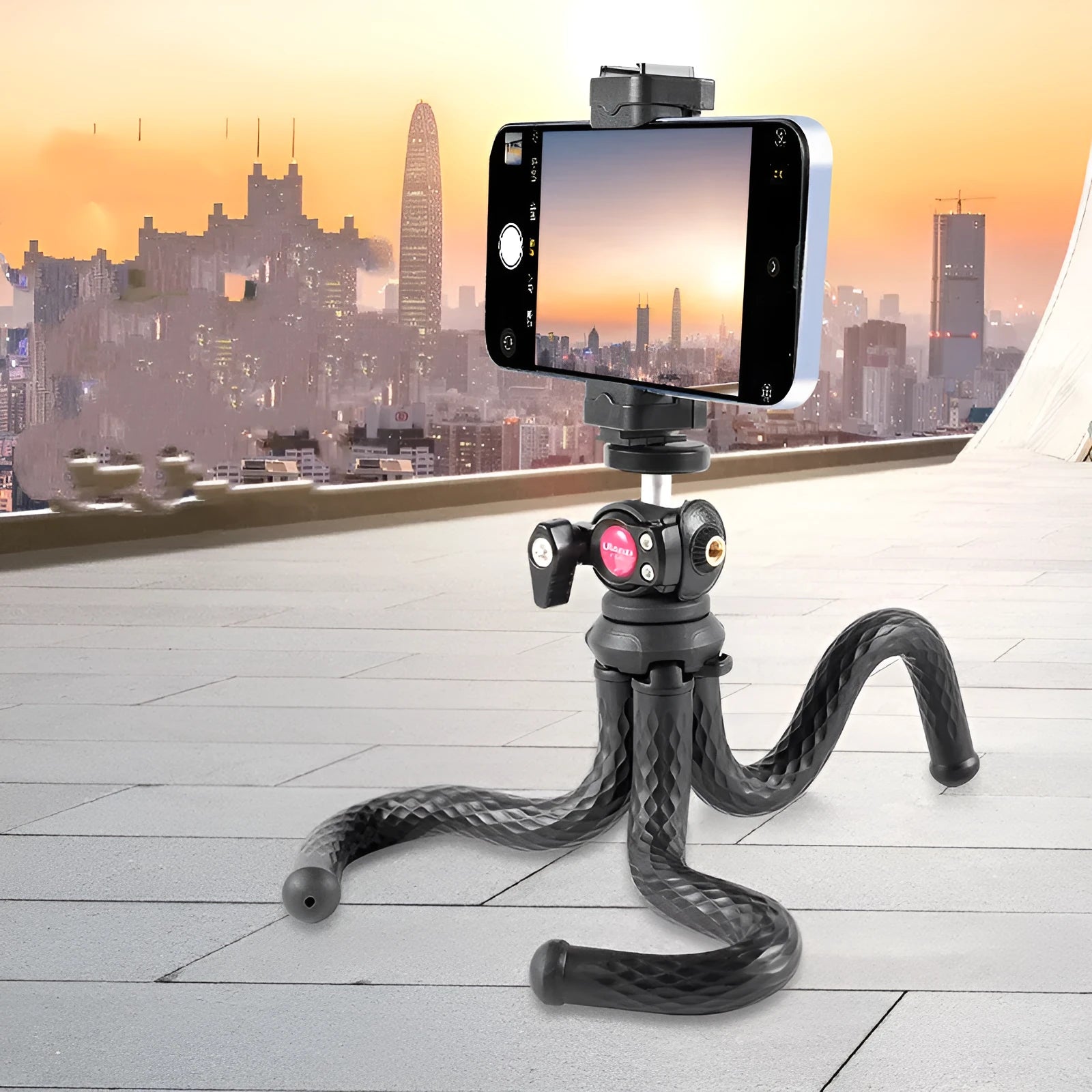 Black octopus-style flexible phone tripod with extended legs and mobile phone clip attached