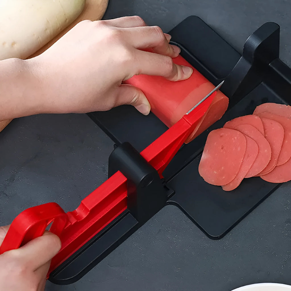 Green multifunctional vegetable cutter on a kitchen counter with stainless steel blade and plastic body