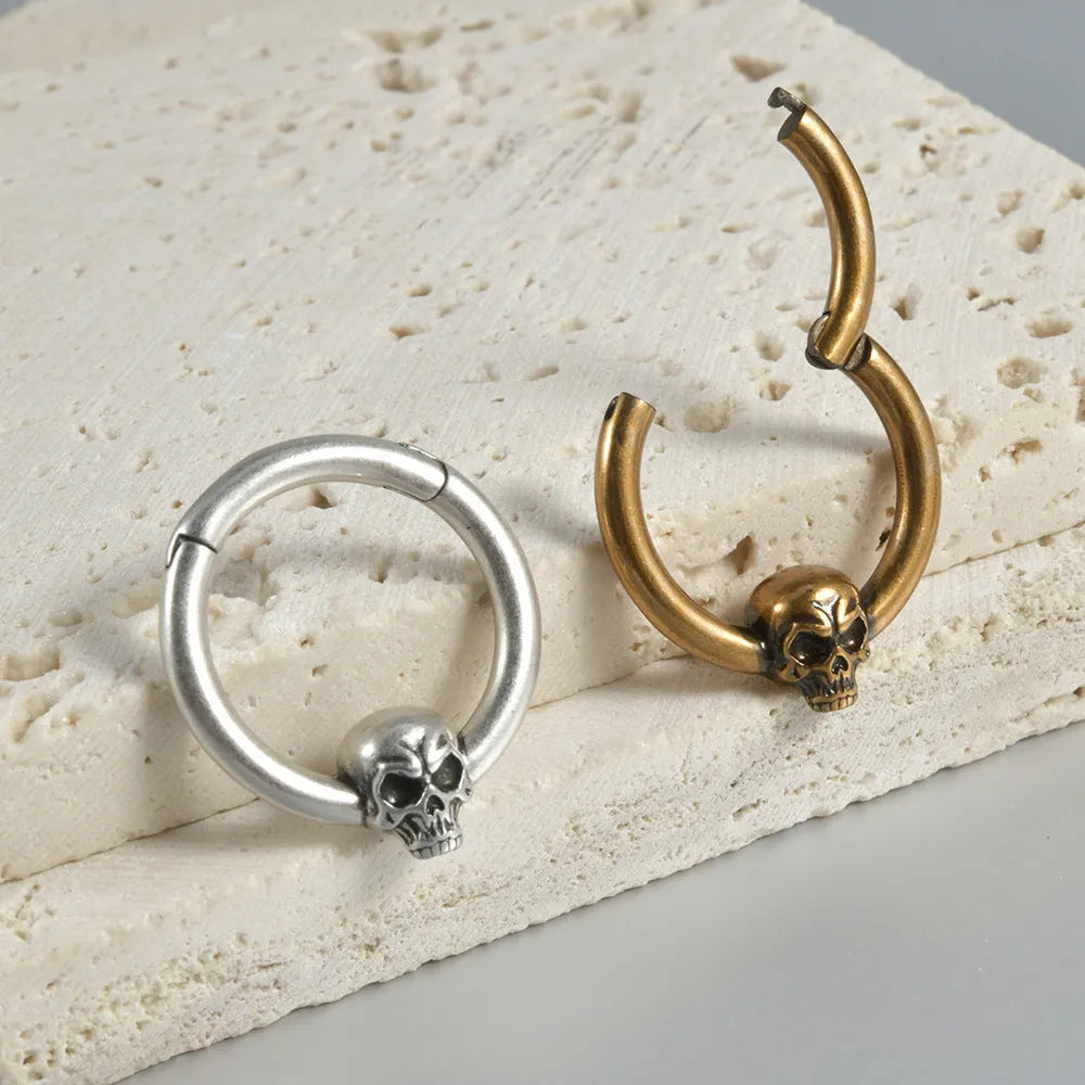Copper punk-style earrings featuring a ghost head motif in antique silver or gold finish.