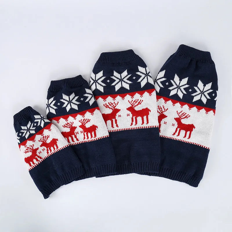 Navy blue knitted Christmas sweater for a dog on a hanger.