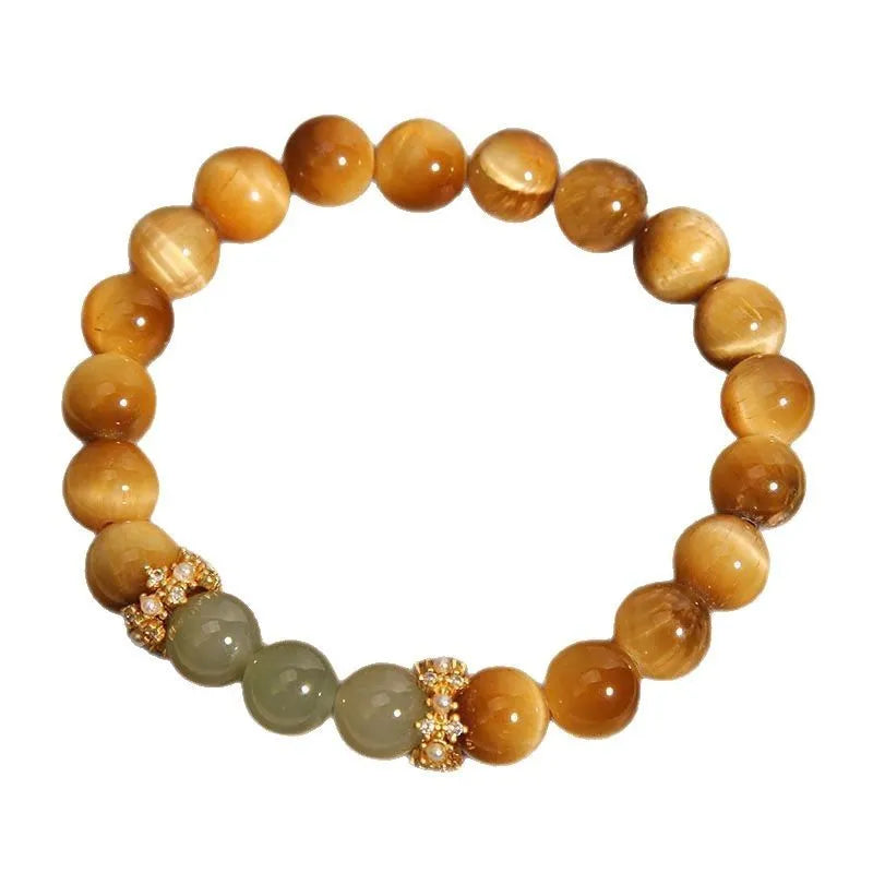 Natural yellow tiger's eye Hetian jade bracelet with diamond polish and auspicious pattern on white background