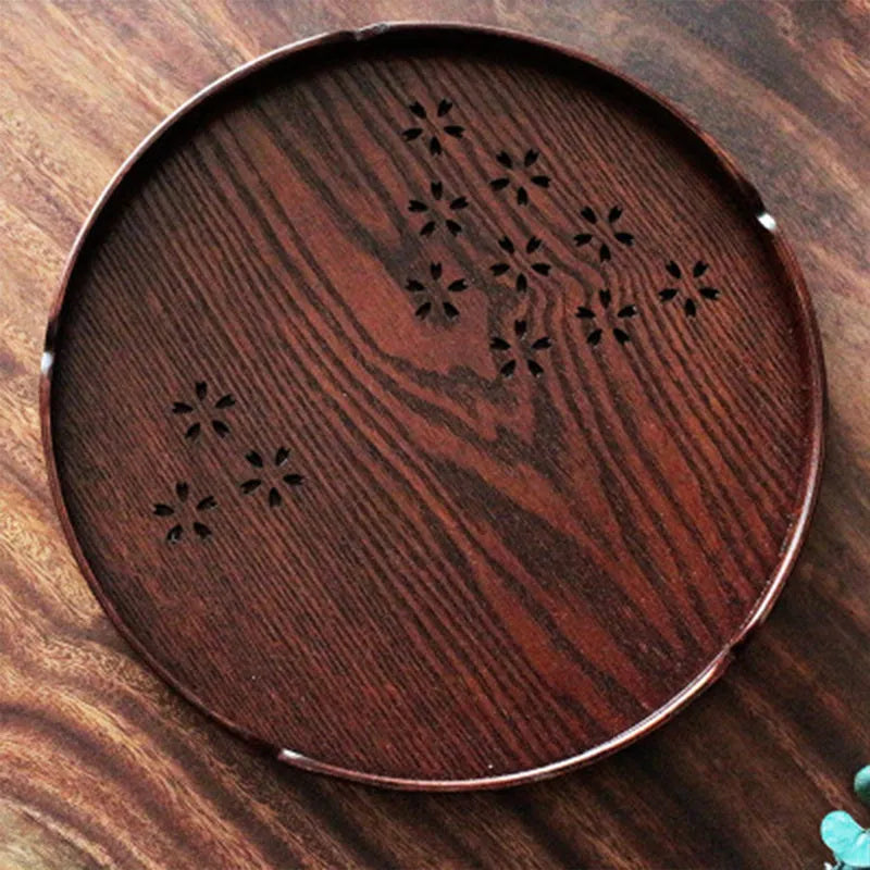 Wooden shallow plate with 12-hole sakura blossom pattern, 30 cm diameter.