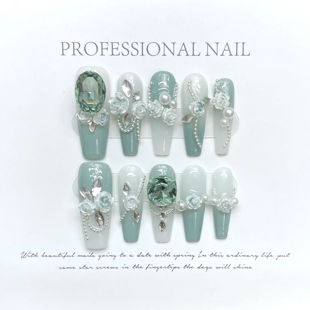 Camellia gradient nail art set with diamond chains, bow and butterfly patterns, and plastic armour suit