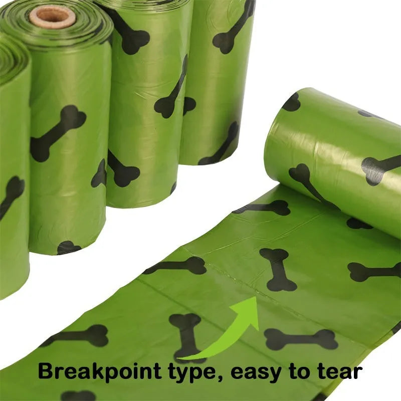 Degradable dog waste bags in army green with black bone printing, showing roll and individual bag
