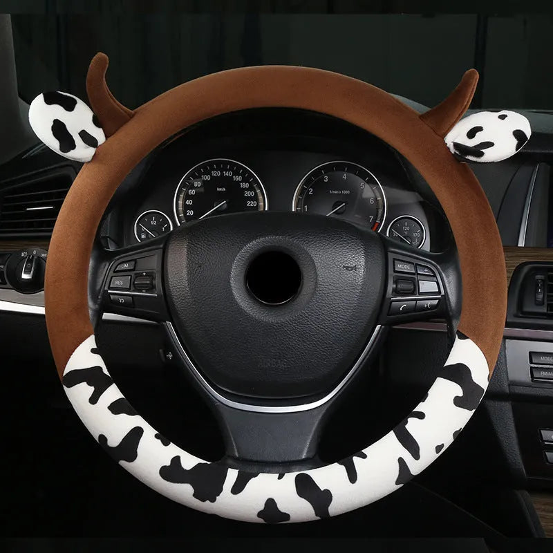 Short plush steering wheel cover for cars in black colour showing textured surface