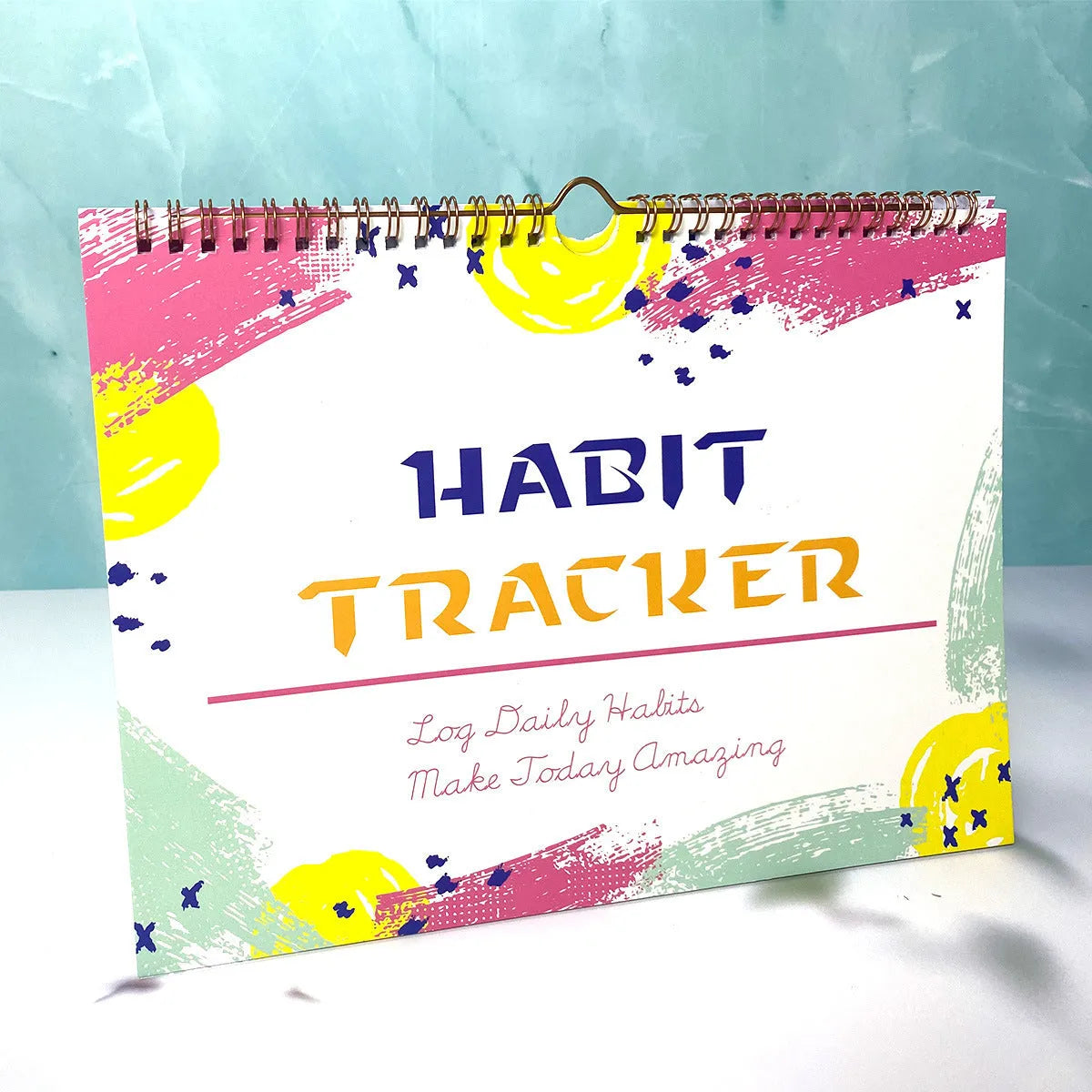 English habit tracking book open showing pages, 21cm by 28cm in flower white colour