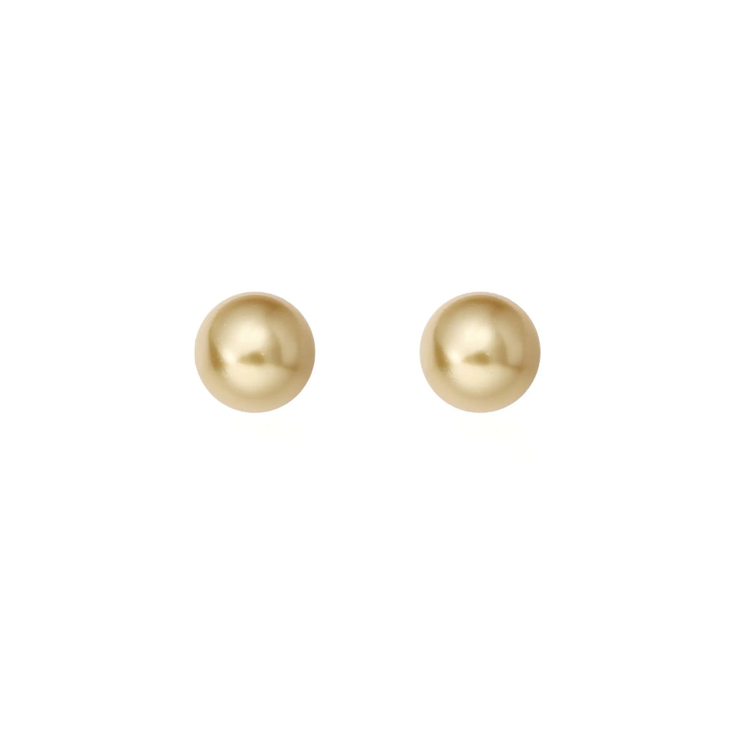 A pair of large geometric pearl stud earrings with an eight-point star accent on a silver setting.