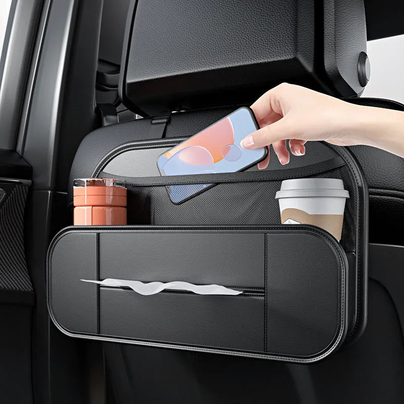 Black leather car seat rear storage bag showing its box shape and size against a vehicle seat.