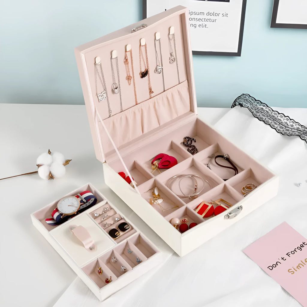 Red large capacity PU jewelry storage box open to show compartments for necklaces, rings, and earrings.