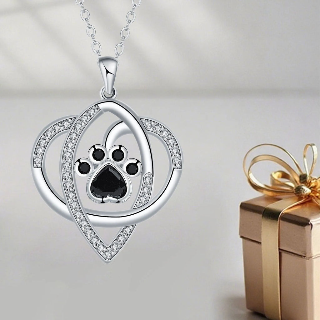 Women's copper necklace with dog and cat paw print pendant on cross chain
