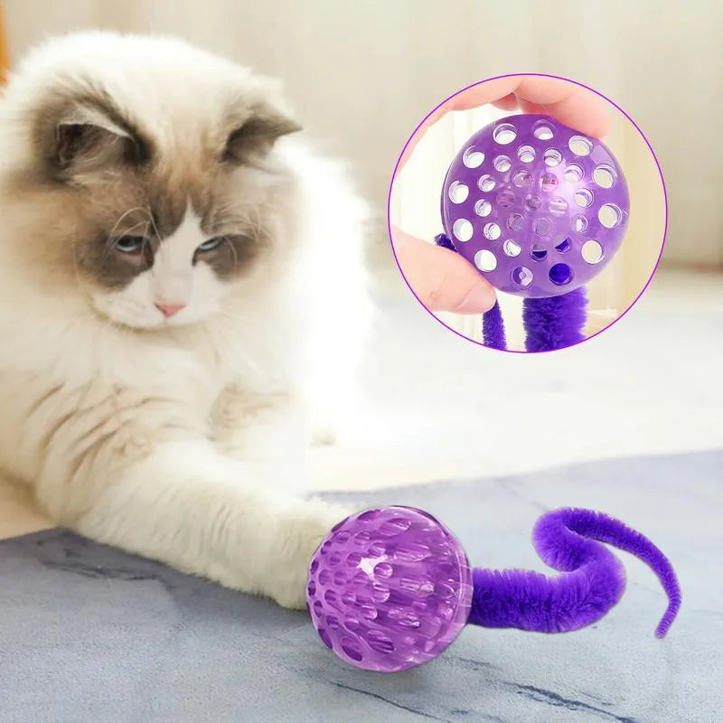 Interactive cat ball toy with plush tail in green, pink, and purple on white background