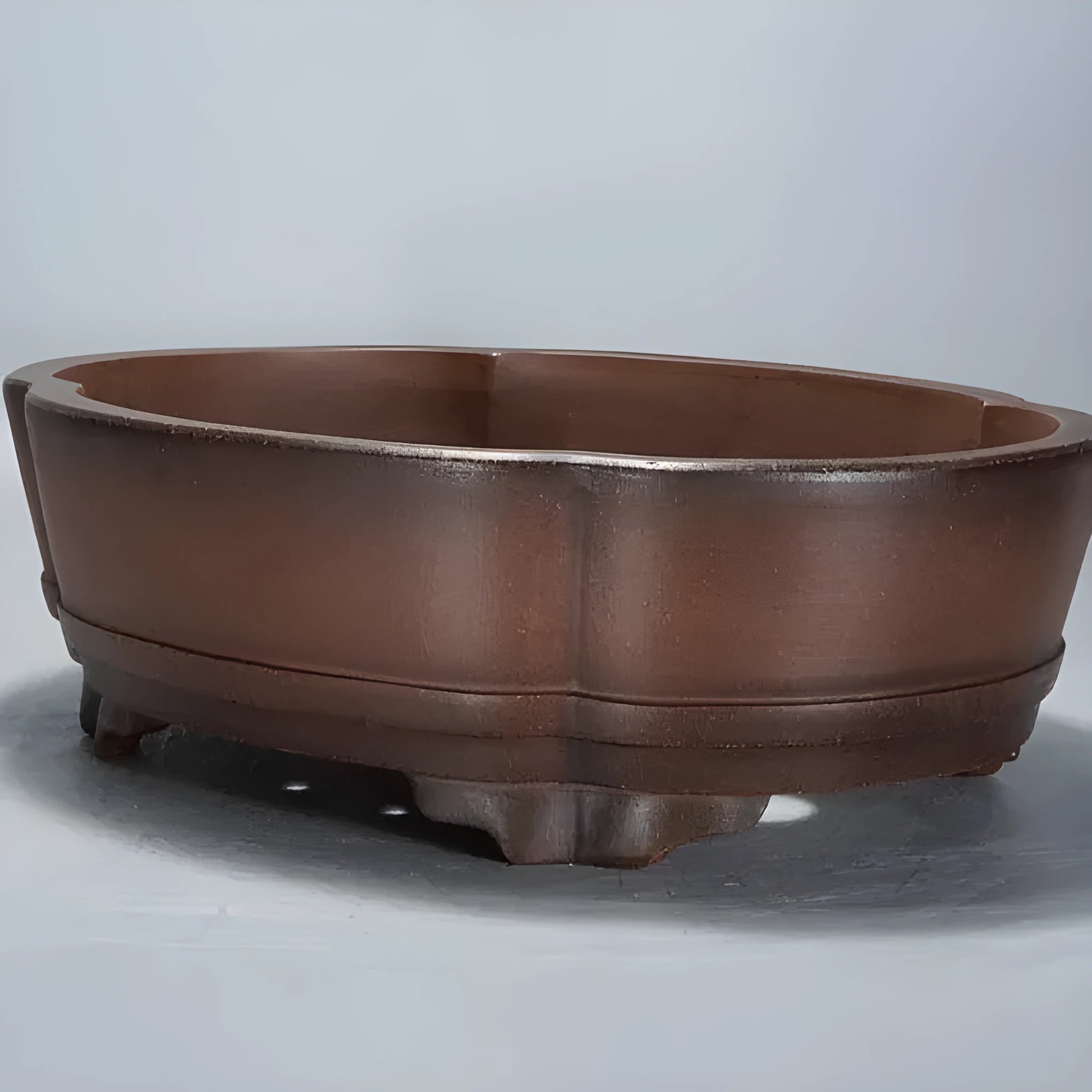 Traditional purple clay flower pot with classical styling for plants and bonsai