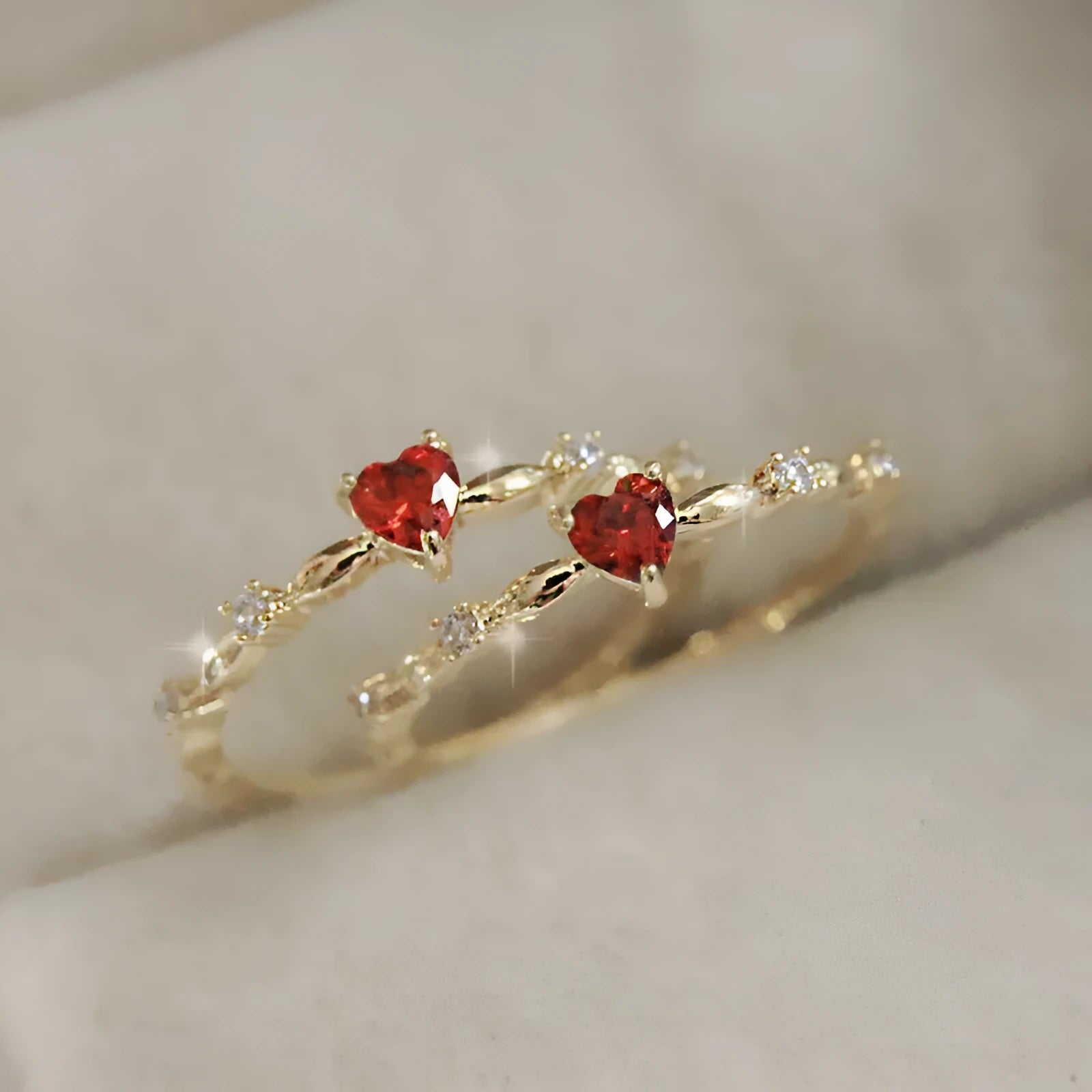Copper zircon peach heart ring in gold on hand, unisex size