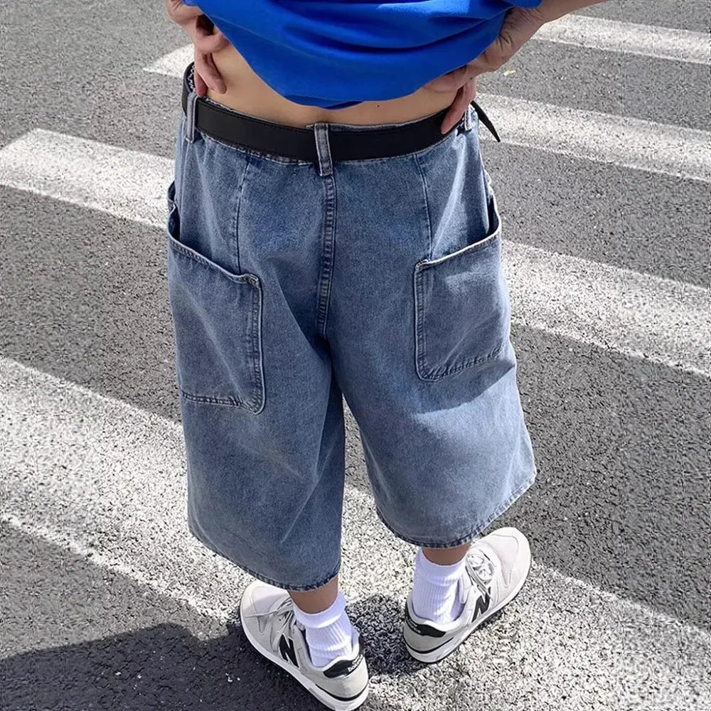 Blue men's denim pirate shorts with high waist, cropped length, and straight legs on a mannequin.