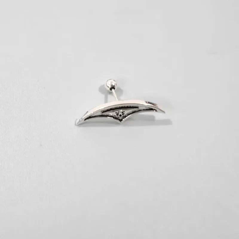 Spider web pattern stud earrings in gold and silver electroplated metal.