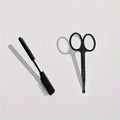Black pet grooming brush with comb for tear stain removal and hair grooming on dogs and cats