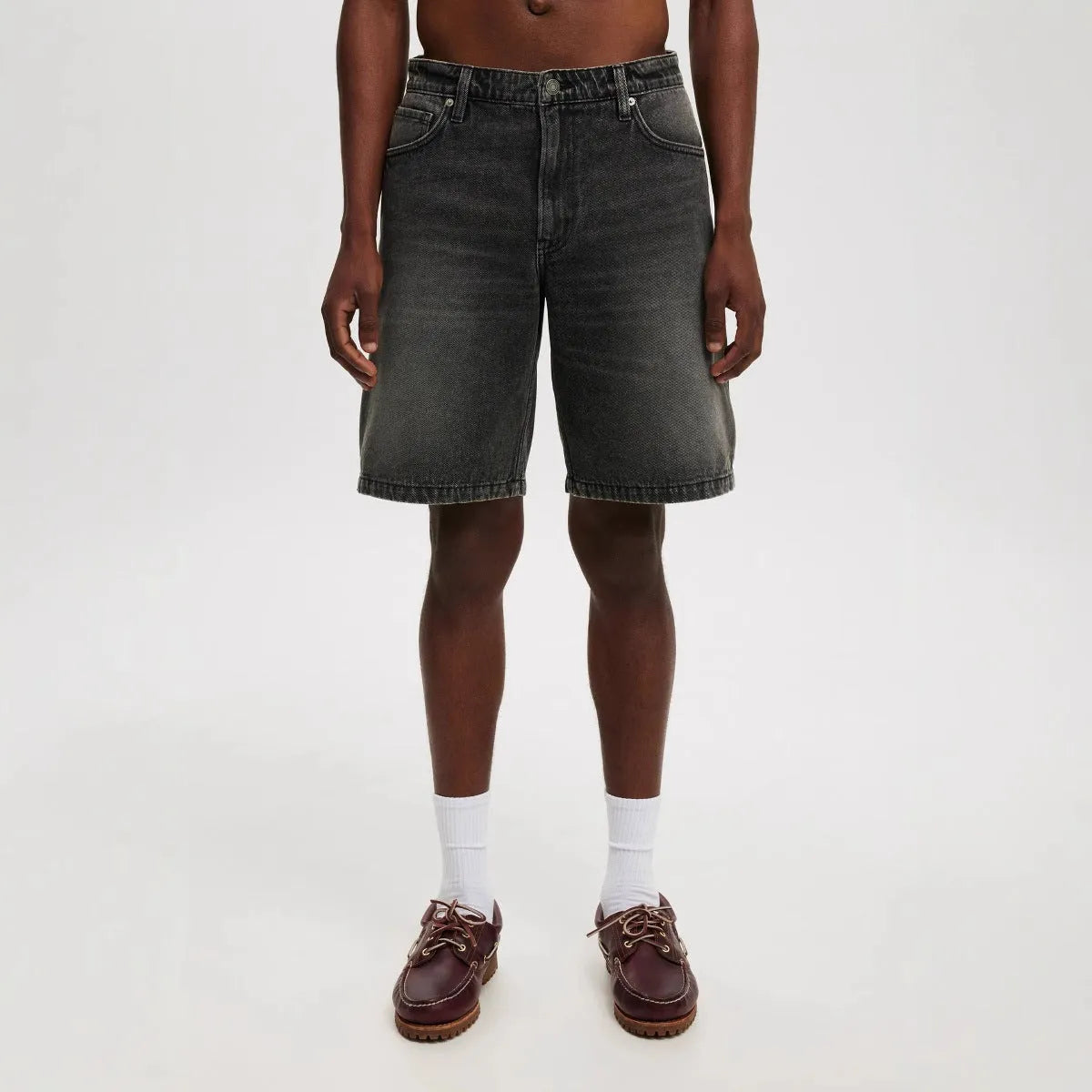 Men's loose straight leg jeans in light blue, black, and grey colour options