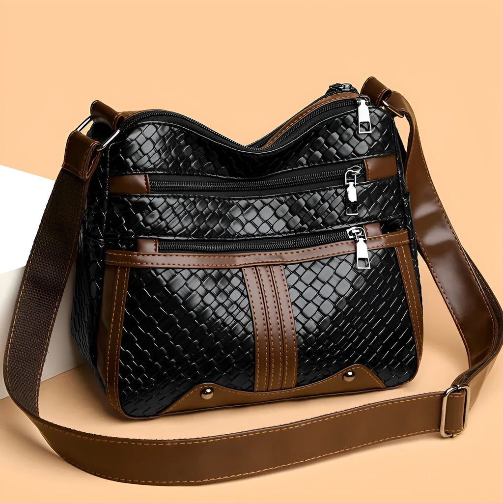 Multi-compartment woven PU leather single shoulder messenger bag in horizontal square shape, brown colour, with zipper change bag interior
