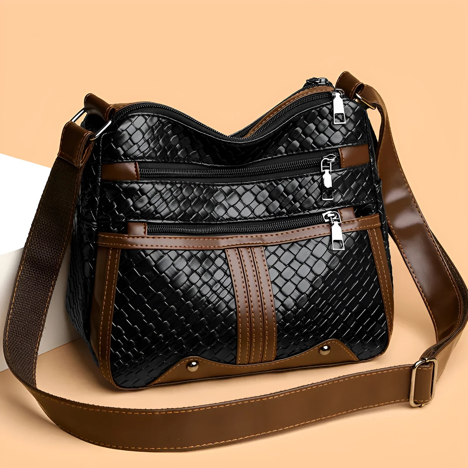 Multi-compartment woven PU leather single shoulder messenger bag in horizontal square shape, brown colour, with zipper change bag interior