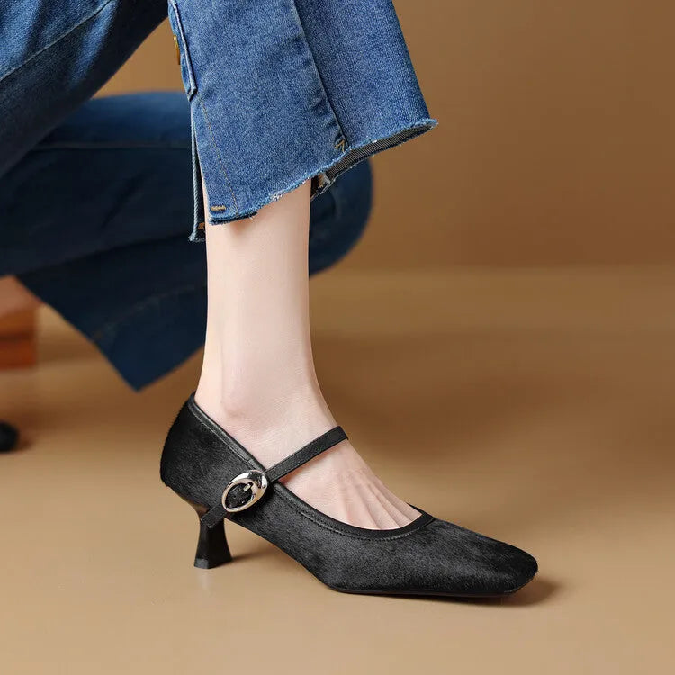 Women's black square toe stiletto ankle-strap heels with horse hair upper on a plain background.