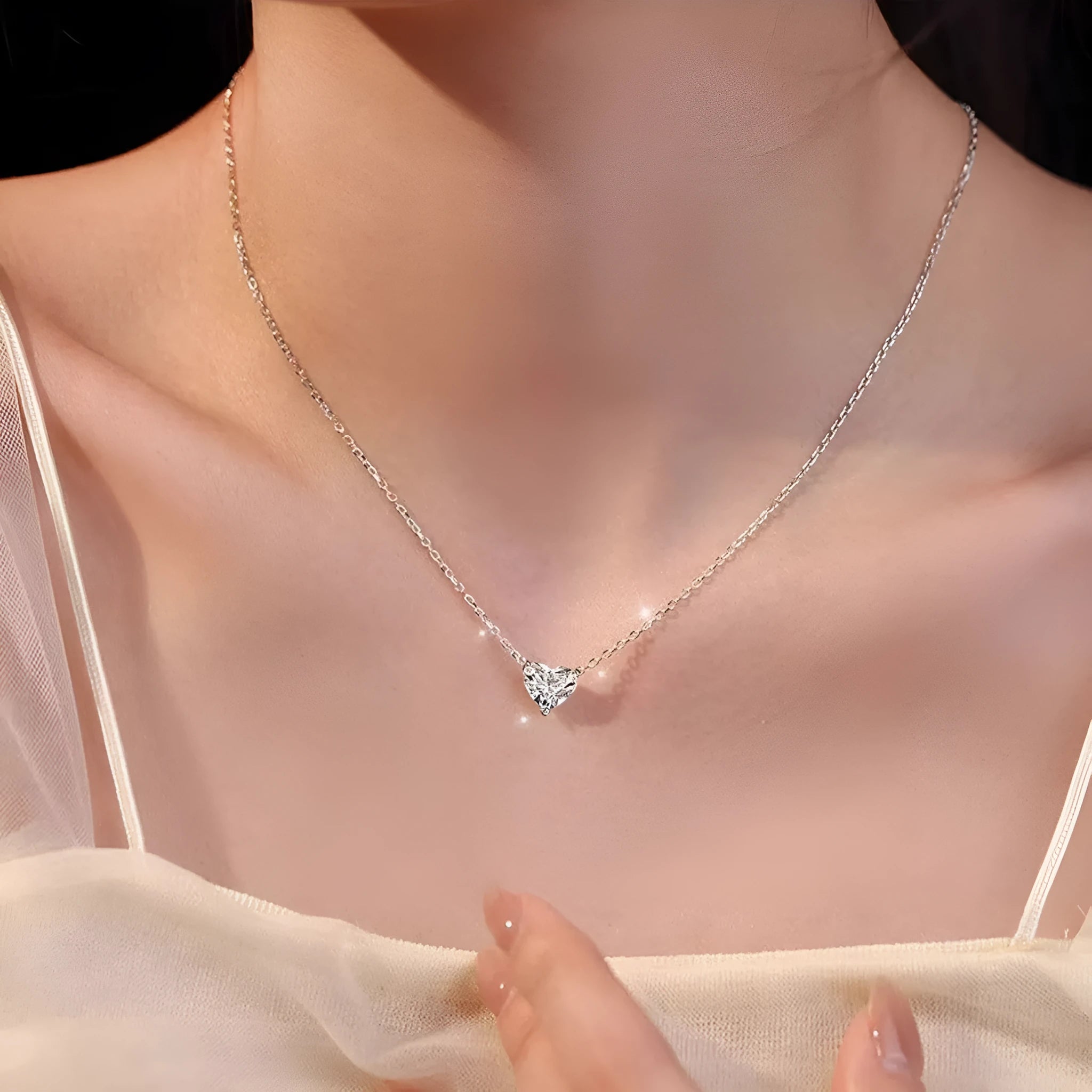 Women's silver heart necklace with simple pendant on chain