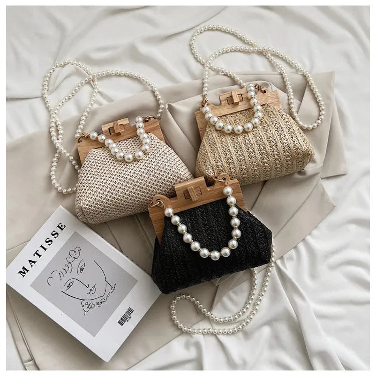 Women's straw woven shoulder bag with beach pearl chain detailing and horizontal square shape