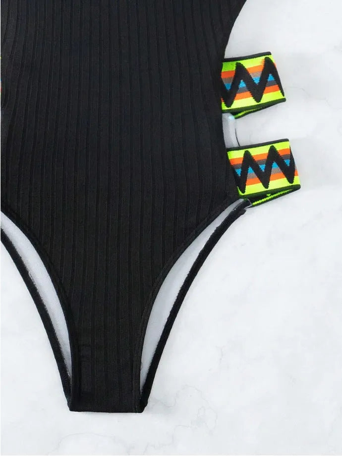 Women's solid black one-piece swimming suit bikini on a mannequin