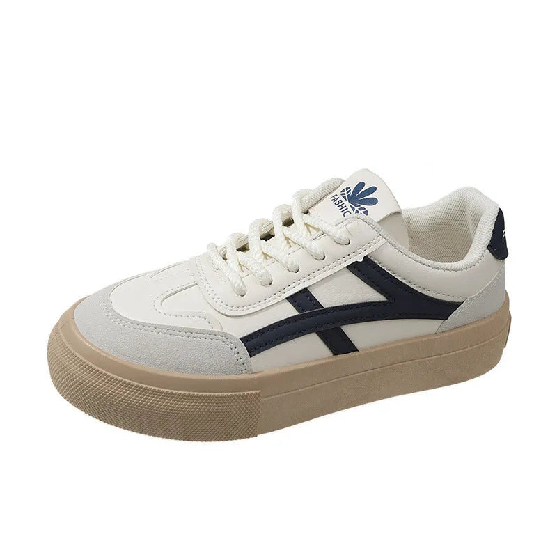 Classic low top sports casual board shoe with rubber sole and patent finish, brown colour, side view