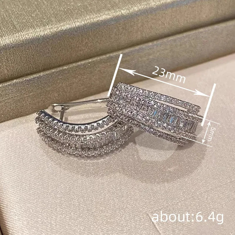 Geometric shaped white gold colour stud earrings with inlaid zircon stone for women.