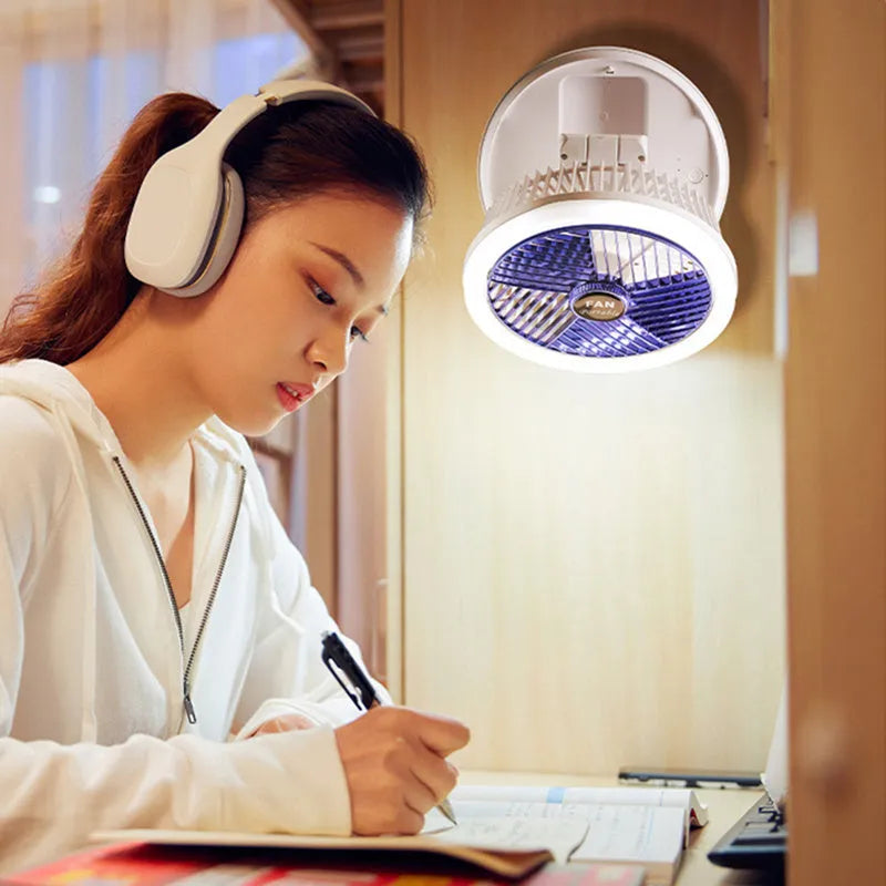 USB charging foldable table fan with LED light and 300-degree rotation on a desk