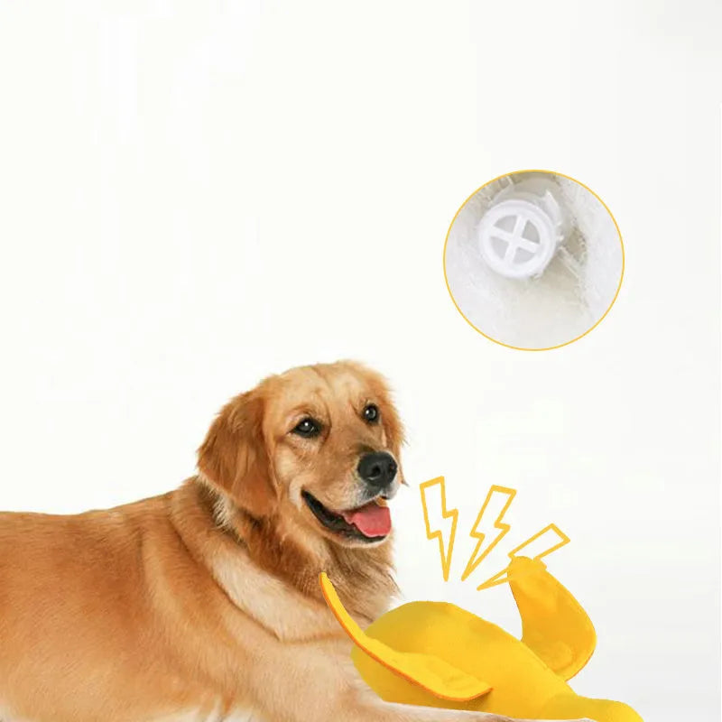 Yellow plush teddy duck dog training toy with squeaker and treat dispensing compartment.
