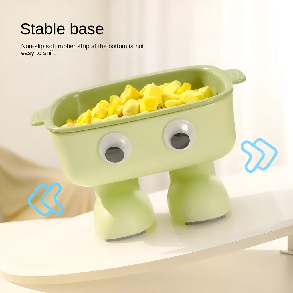 Green elevated cat bowl with robot shape design on anti-slip base showing tilted angle for feeding