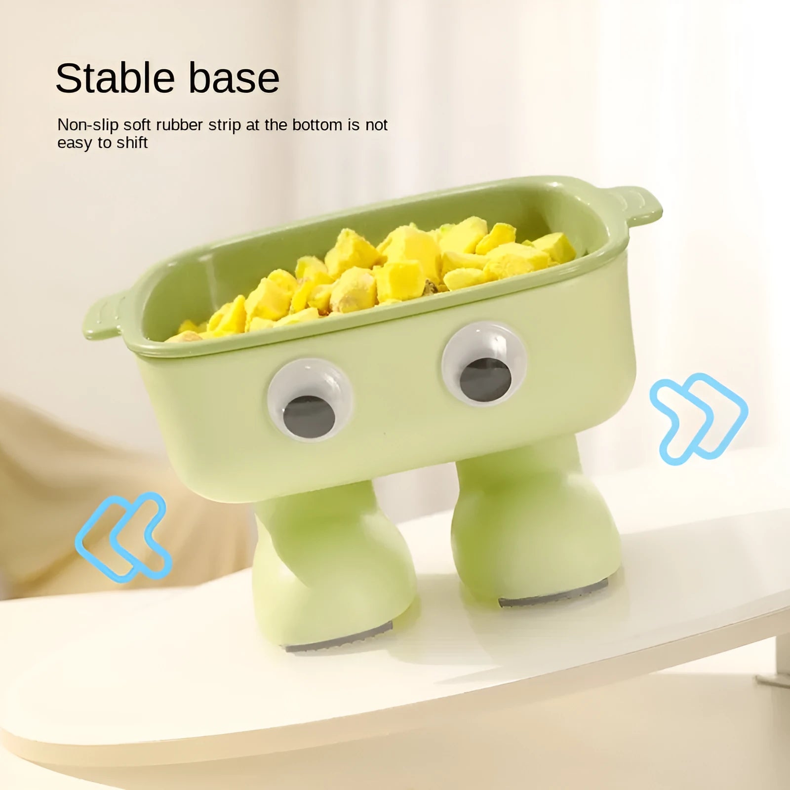 Green elevated cat bowl with robot shape design on anti-slip base showing tilted angle for feeding