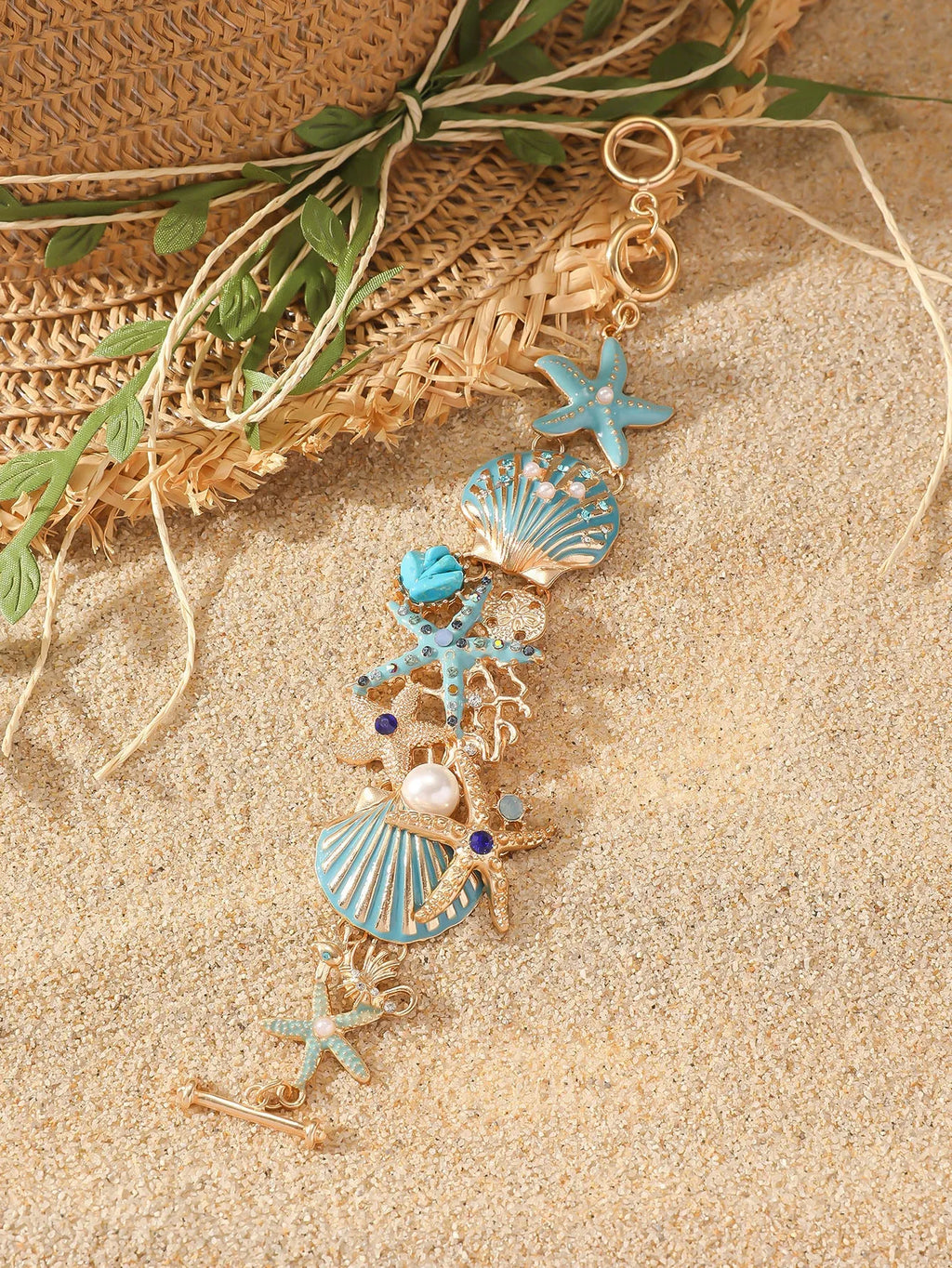 Women's alloy bracelet with a boat anchor charm, starfish, and rhinestones in turquoise, red, or blue.