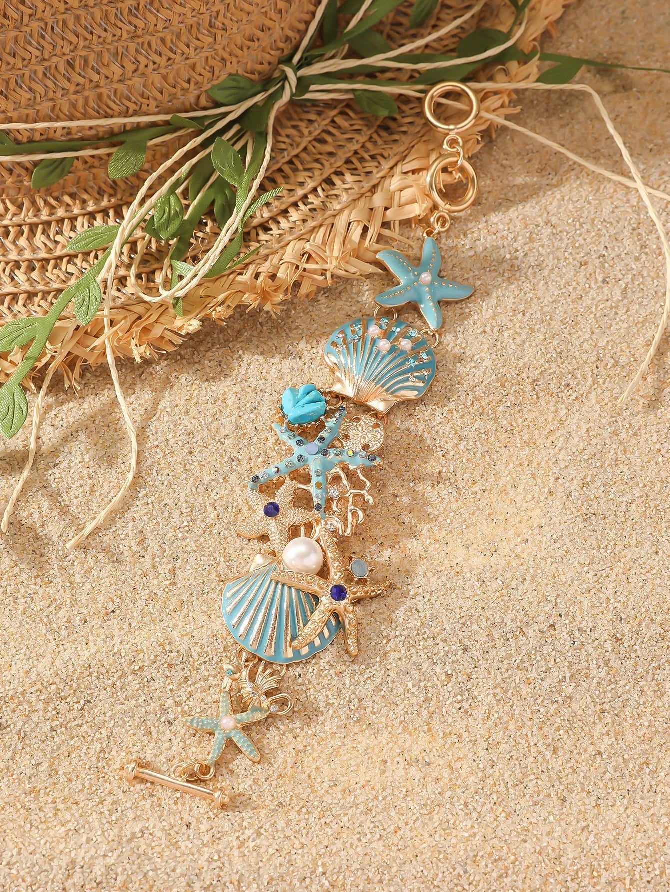 Women's alloy bracelet with a boat anchor charm, starfish, and rhinestones in turquoise, red, or blue.