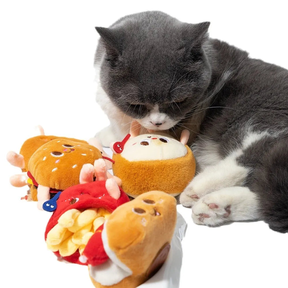 Cat mint teething toy shaped like a hamburger and chicken leg, made from soft plush fabric, on a light background.