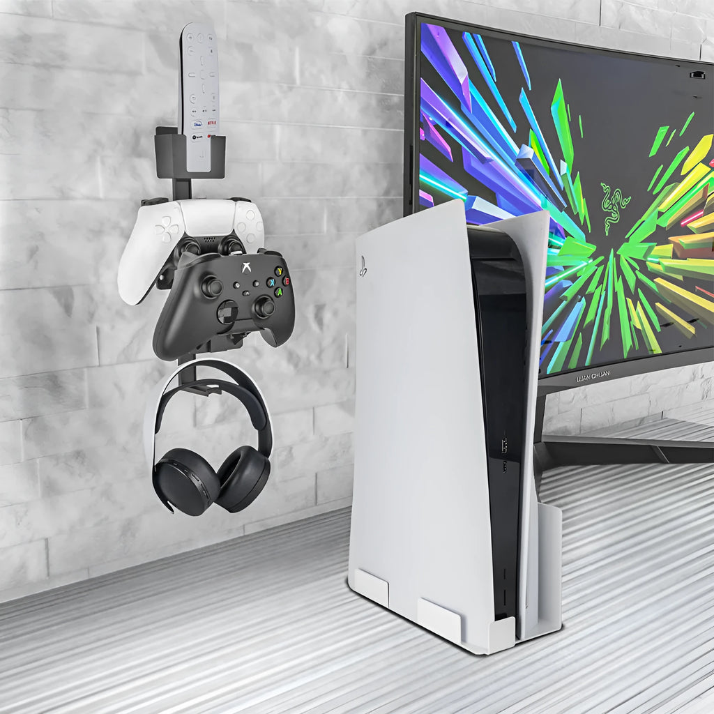White wall-mounted hook holding PS5 controller with black gaming headset hanging beside it