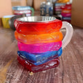 Decorative resin cup with a painted bookmark design in Library style.