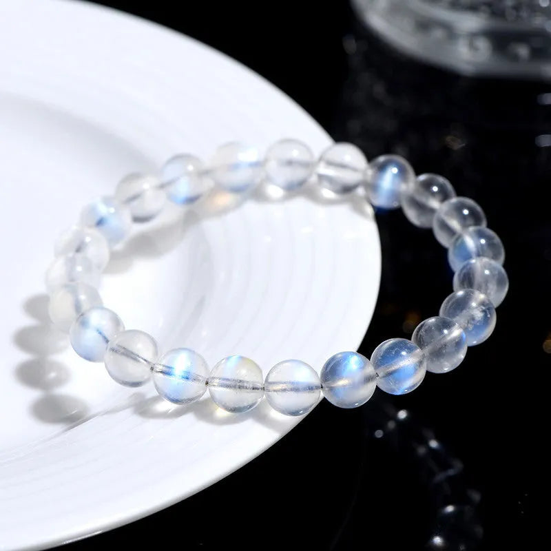 Natural cream body blue moonlight crystal bracelet on a plain background showing its size and style.