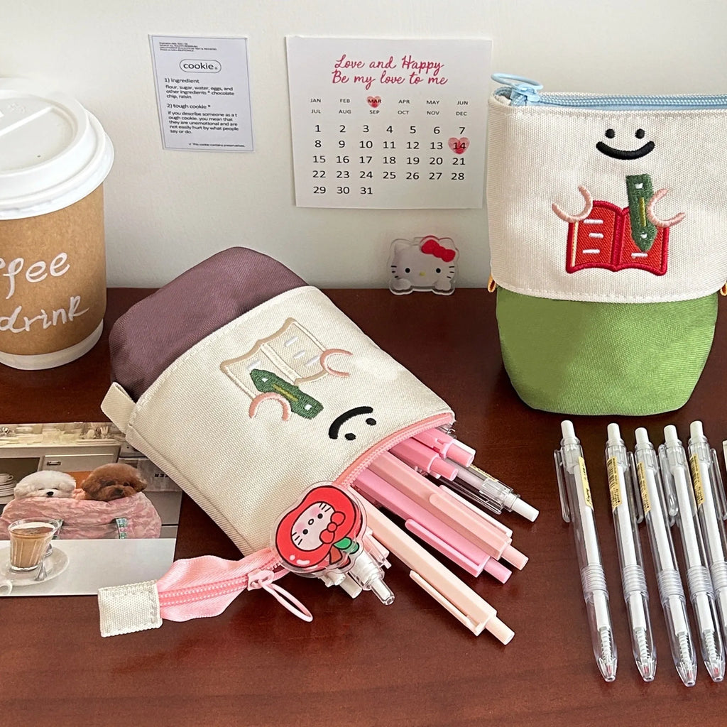 Brown Korean-style collapsible pencil case made from Oxford fabric, showing large capacity design.