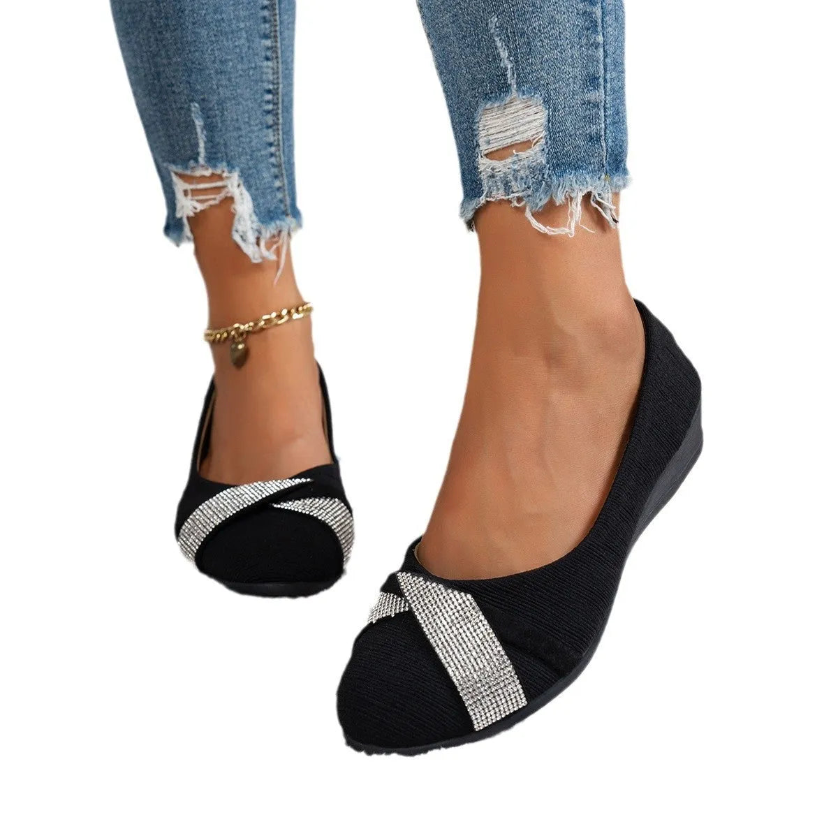 Black women's slip-on casual shoes with rhinestone details on the fabric upper and a chunky short heel.